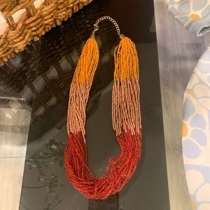 Gold multi colored beaded necklace. Never worn.